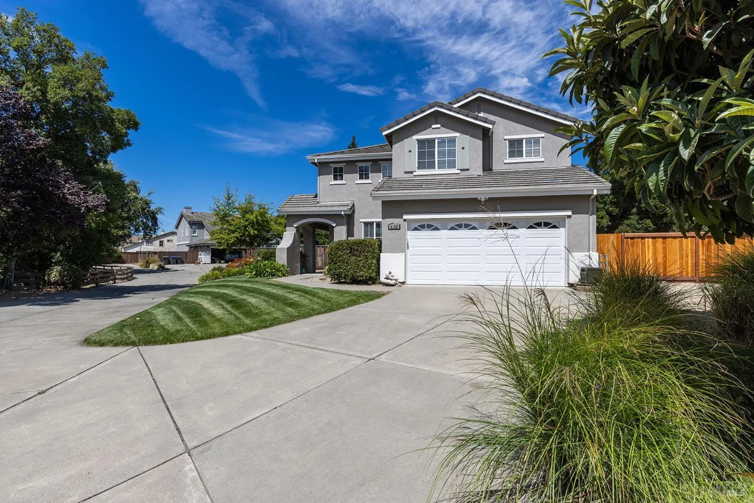 Daytime front exterior and driveway at 4122 Cedar Creek Court