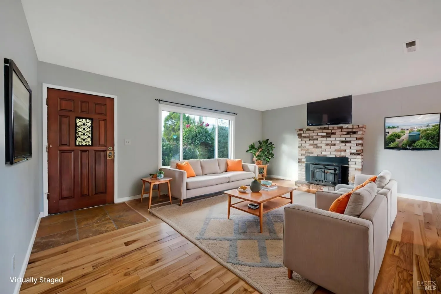 Virtually staged living room with fireplace and seating