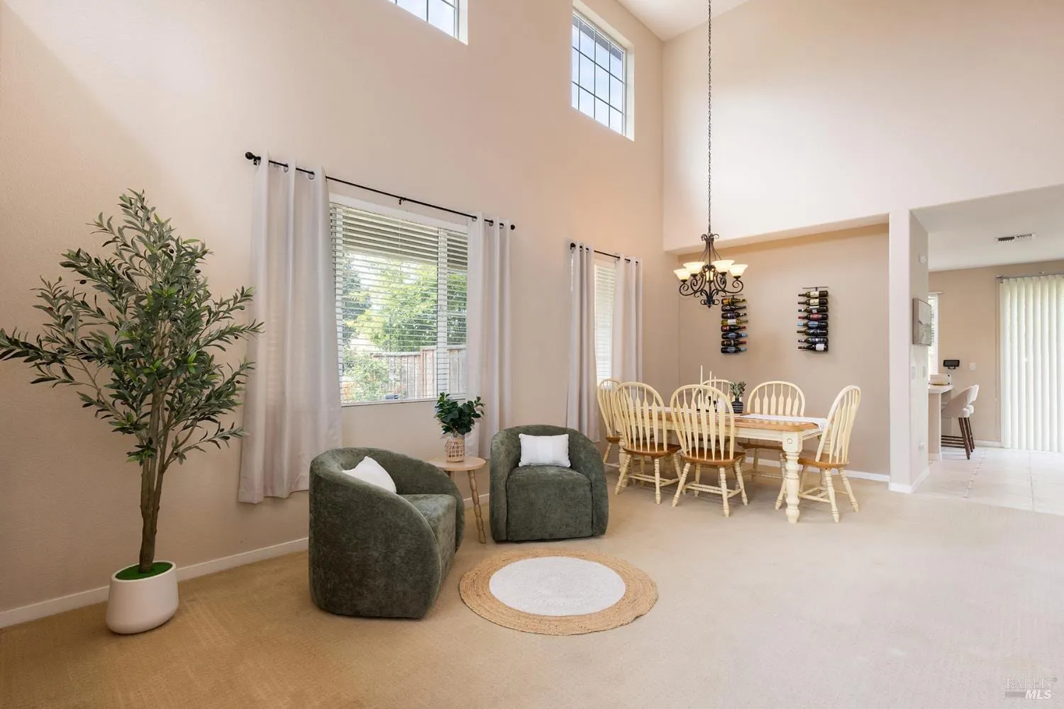 Formal dining space with chandelier and wall-mounted wine racks